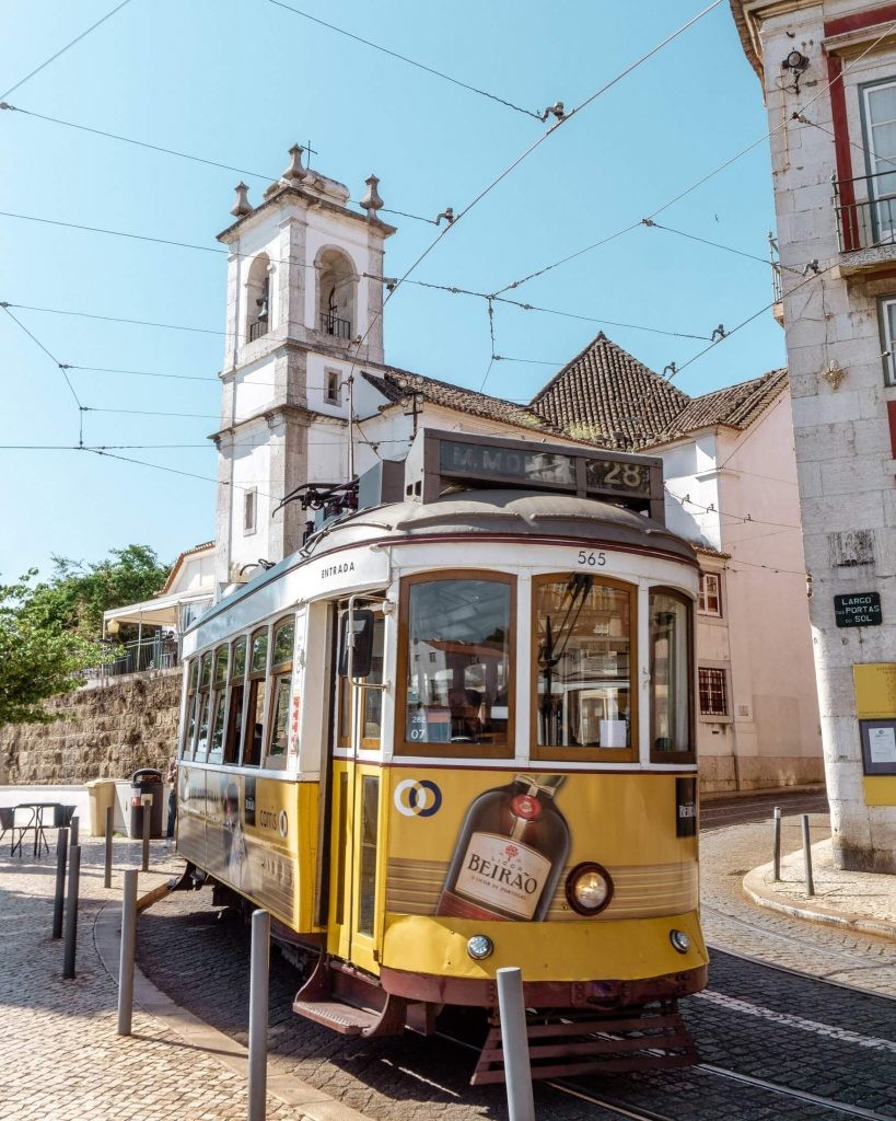Buy a full-day pass for the trams and take the famous tram 28 in Lisbon (the vintage yellow one) that will take you from one stop to another around the city