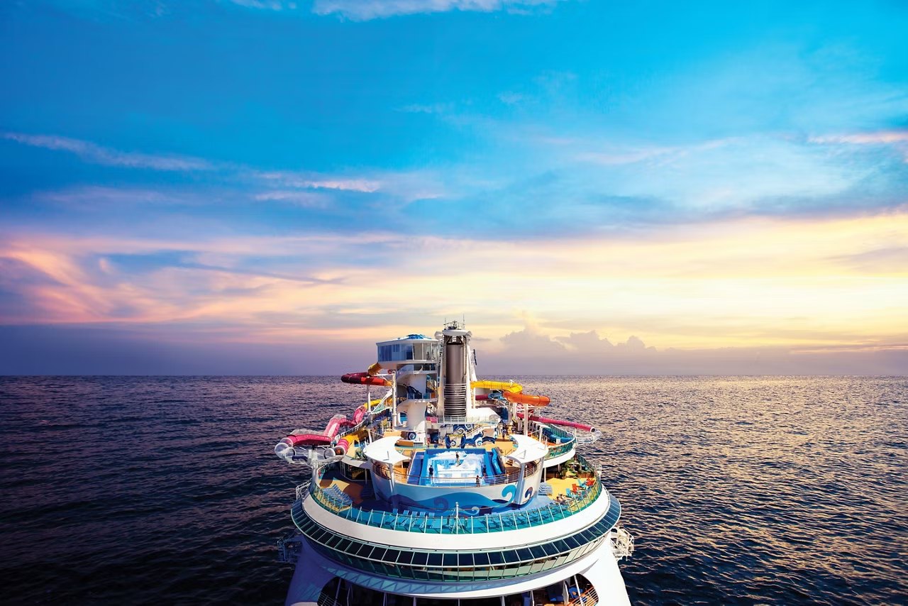 Navigator of the Seas sailing at sunset
